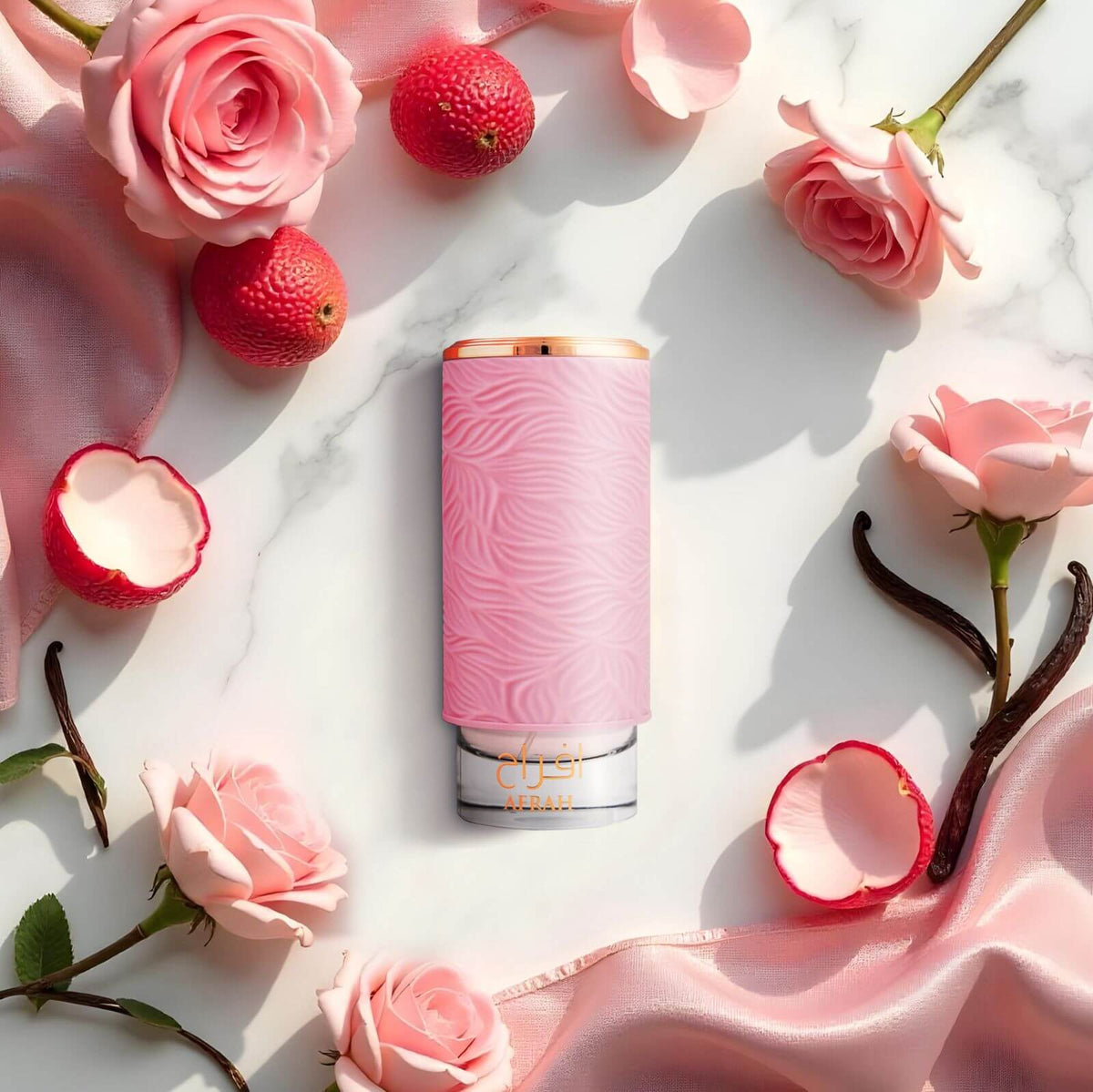Pink cylindrical product with floral and fruit elements on a marble surface